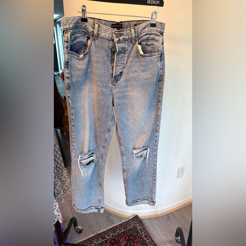 Distressed slim blue jeans